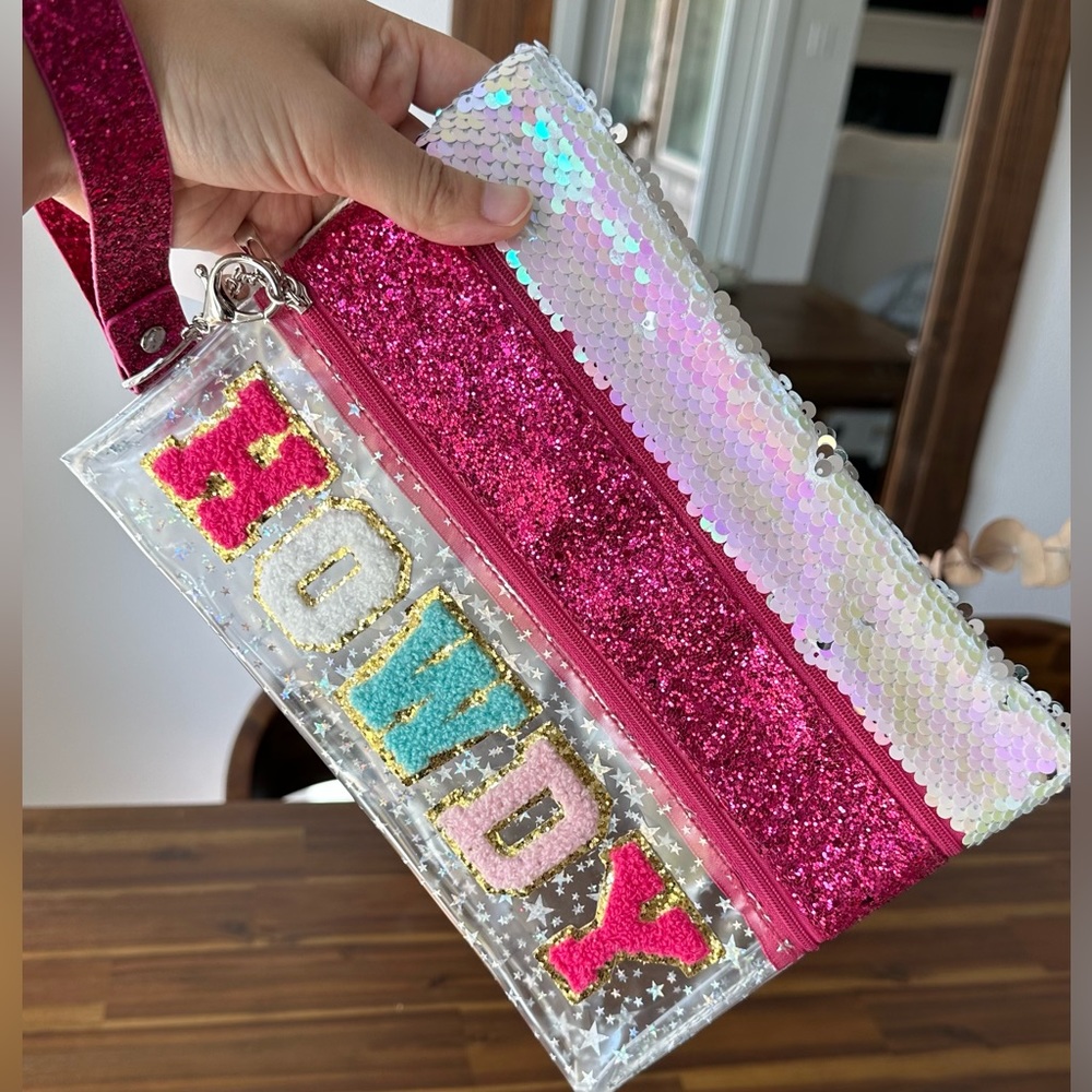Clear bag with HOWDY patch. Sequin and glitter material